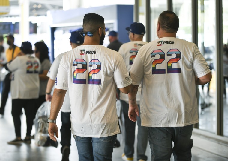 Attendees wearing special LGBTQ+ Pride Night commemorative shirts at Dodger Stadium in Los Angeles