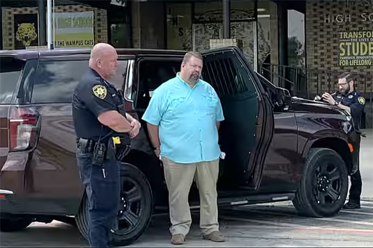Michael Stevens, a superintendent at Itasca Independent School District, is taken into custody by Harris County police in Houston, on June 1, 2023.