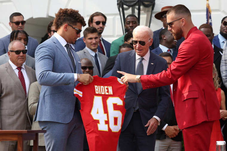 Quarterback Patrick Mahomes (L) and tight end Travis Kelce of the NFL Kansas City Chiefs present U.S. President Joe Biden with a team jersey at the White House on June 05, 2023 in Washington, DC. The Chiefs are the 2023 Super Bowl champions.
