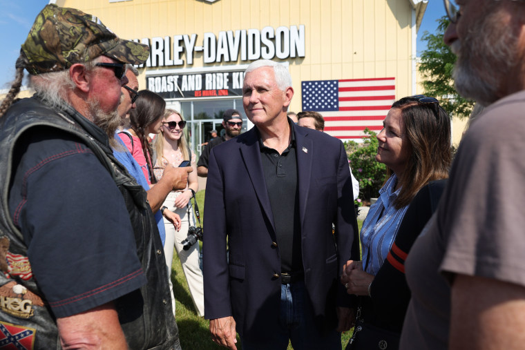Mike Pence meets other riders before for the start of Joni Ernst's Roast and Ride in Des Moines, Iowa