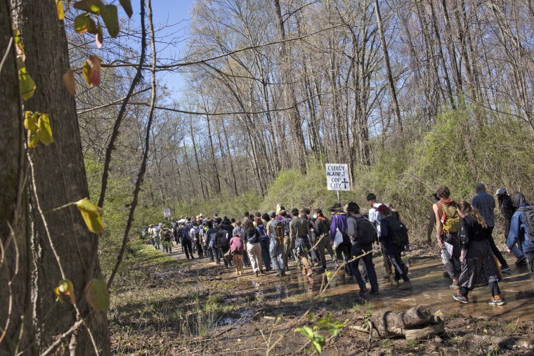 Activists march through the Atlanta Forest, the site of a proposed police training center, on March 4, 2023 in Atlanta.