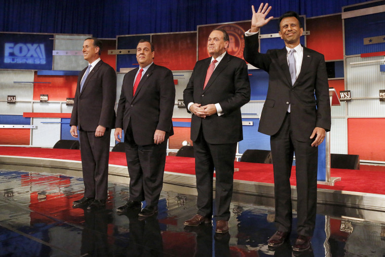 Republican presidential candidates Rick Santorum, Chris Christie, Mike Huckabee and Bobby Jindal take the stage during the Republican presidential debate in Milwaukee on Nov. 10, 2015.