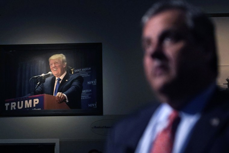 A photograph of former President Trump hangs on the wall as Former Gov. Chris Christie speaks in Manchester, N.H.