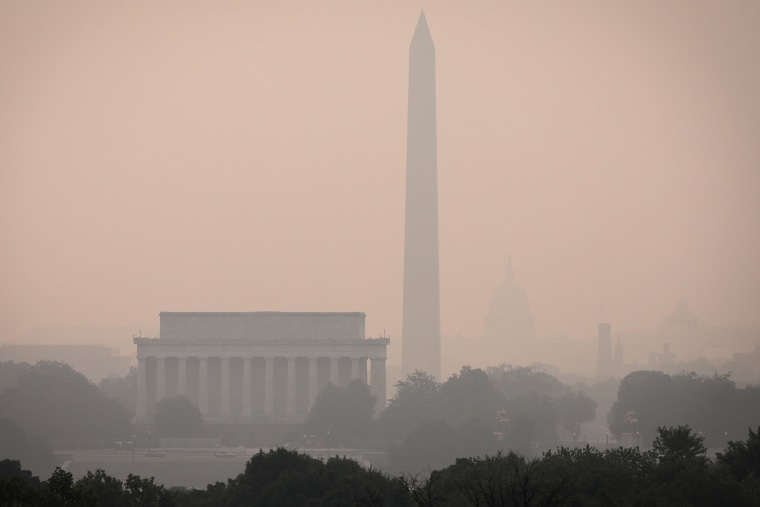 Hazy skies blanket the monuments and skyline of Washington, D.C. on June 7, 2023 as seen from Arlington, Va.