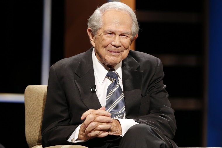 FILE - Rev. Pat Robertson poses a question to a Republican presidential candidate during a forum at Regent University in Virginia Beach, Va., Oct. 23, 2015. Robertson, a religious broadcaster who turned a tiny Virginia station into the global Christian Broadcasting Network, tried a run for president and helped make religion central to Republican Party politics in America through his Christian Coalition, has died. He was 93. Robertson's death Thursday, June 8, 2023 was announced by his broadcasting network. (AP Photo/Steve Helber, File)