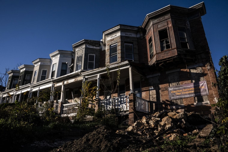 Inhabited and abandoned homes are seen along Walbrook Avenue in West Baltimore, Md., on Nov. 9, 2022.