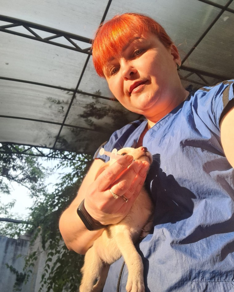 Irina Tutyun with a puppy in Kherson on Thursday.