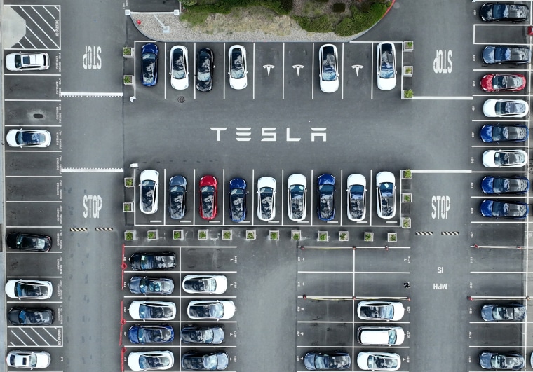 Cars in a lot at the Tesla factory in Fremont, Calif., in 2022. 