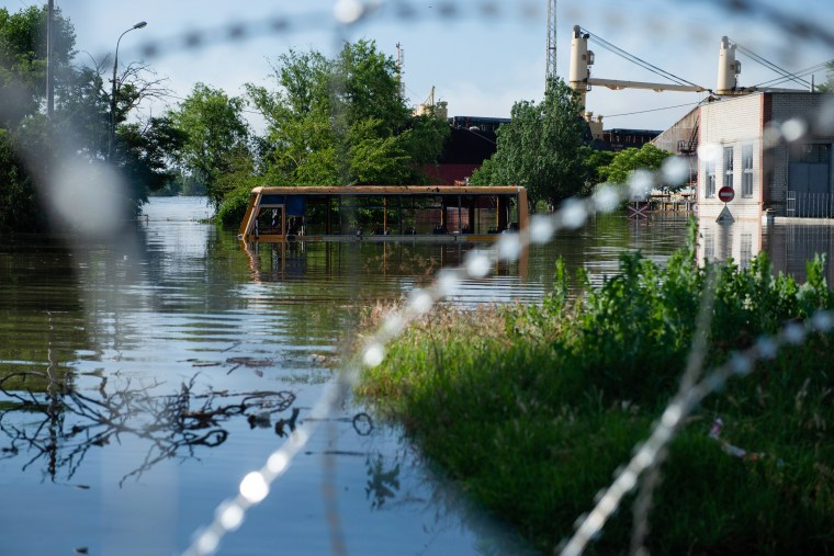 A bus submerged in floodwaters in Kherson after the bursting
