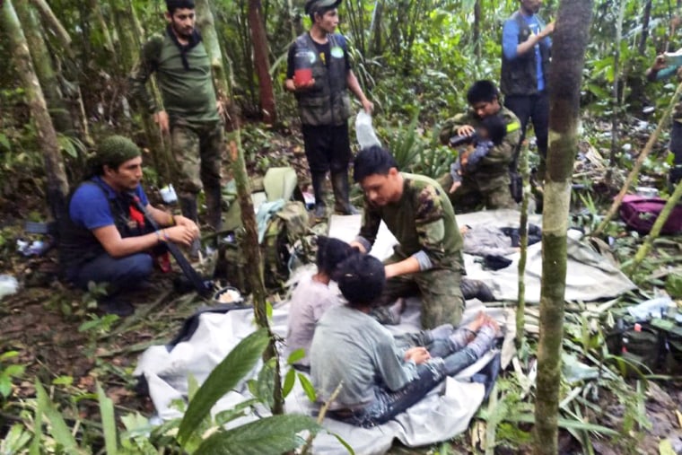 In this handout photo released on June 9, 2023, by the Colombian Presidency, members of the army assist four Indigenous children who were found alive after spending more than a month lost in the Colombian Amazon jungle following the crash of a small plane. Four Indigenous children were found alive Friday after spending more than a month lost in the Colombian Amazon rainforest following a small plane crash that triggered a massive rescue operation, the country's President Gustavo Petro said. 