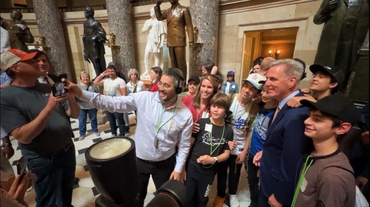 McCarthy, posing with another group of tourists in the Capitol on June 8, 2023.