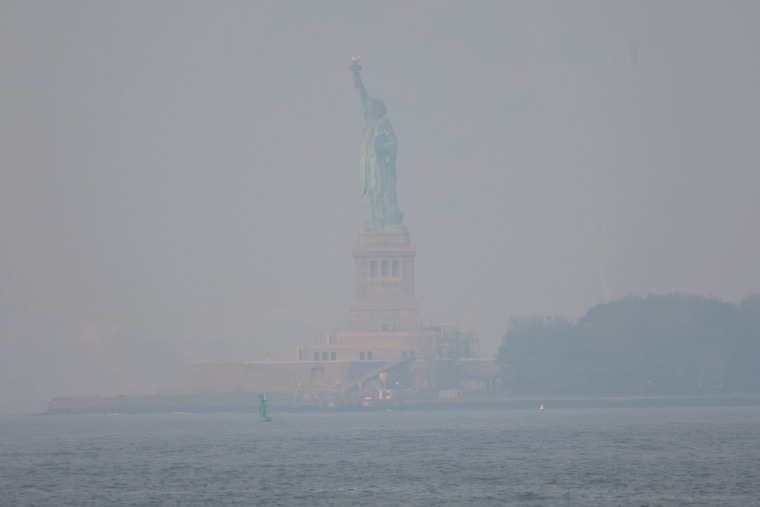 The Statue of Liberty seen through haze June 8, 2023.