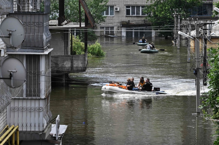 Ukraine and Russia accused each other of shelling in the flood-hit Kherson region on June 8, 2023 even as rescuers raced to save people stranded after the destruction of a Russian-held dam unleashed a torrent of water. 