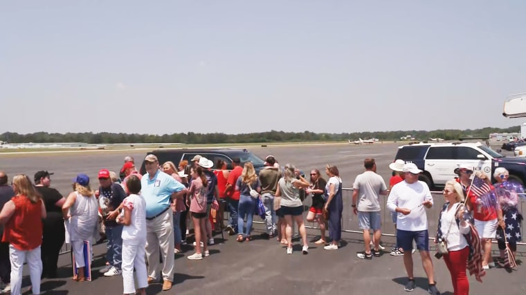 People wait for Donald Trump on the tarmac at Columbus Airport