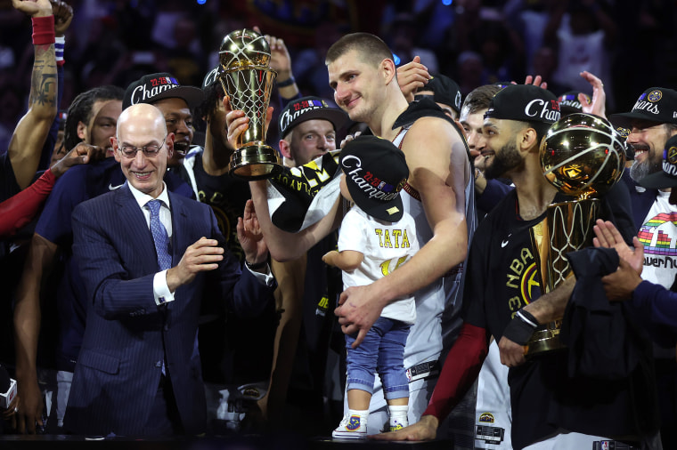 DENVER, COLORADO - JUNE 12: Nikola Jokic #15 of the Denver Nuggets is presented the Bill Russell NBA Finals Most Valuable Player Award after a 94-89 victory against the Miami Heat in Game Five of the 2023 NBA Finals to win the NBA Championship at Ball Arena on June 12, 2023 in Denver, Colorado. NOTE TO USER: User expressly acknowledges and agrees that, by downloading and or using this photograph, User is consenting to the terms and conditions of the Getty Images License Agreement. (Photo by Matthew Stockman/Getty Images)