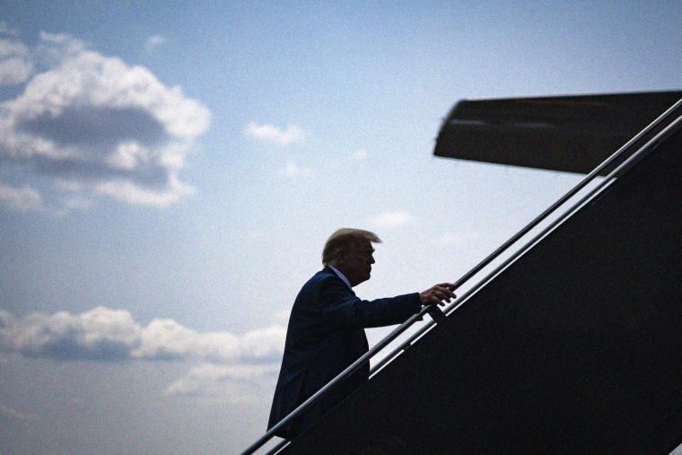 Image: Former President Donald Trump boards an airplane in Newark, New Jersey, on June 10.