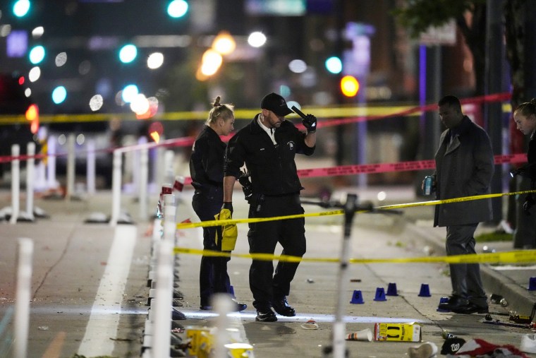 Denver Police investigators respond to a mass shooting on June 13, 2023, during a celebration after the Denver Nuggets won the team's first NBA Championship.
