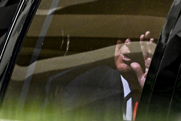 Former President Donald Trump waves after leaving the Wilkie D. Ferguson Jr. United States Federal Courthouse in Miami on June 13, 2023.