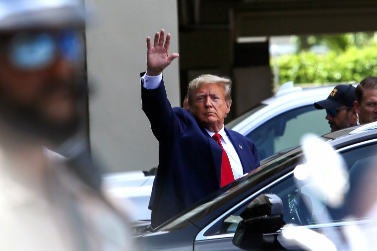 Former President Donald Trump waves as he makes a visit to the Cuban restaurant Versailles in Miami on June 13, 2023.