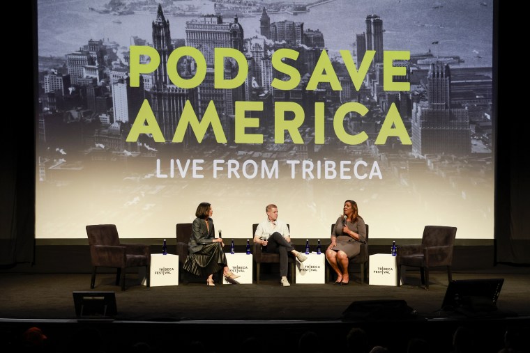 Alex Wagner, Daniel Pfeiffer and New York Attorney General Letitia James during a live taping of "Pod Save America" in New York on June 12, 2023.