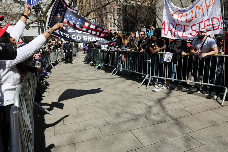 Image: Supporters and opponents of former President Donald Trump gather near Manhattan Criminal Court before Trump's arraignment in New York on April 4.