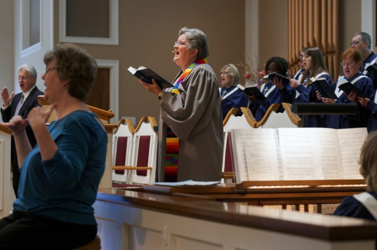 The Rev. Linda Barnes Popham sings with the choir at Fern Creek Baptist Church in Louisville, Ky., on May 21, 2023.