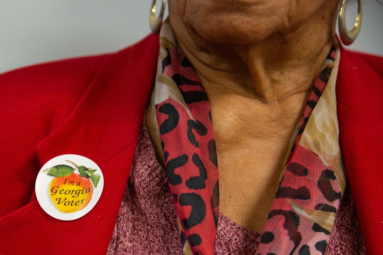 A voter wears a sticker that reads "I'm a Georgia Voter" at a polling station in Atlanta. 