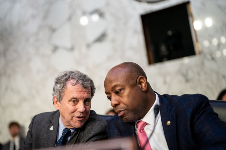 Sherrod Brown, left, and Tim Scott in the Hart Senate Office Building on Capitol Hill
