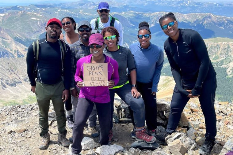 Members of Vibe Tribe Adventures gather at Grays Peak in Colorado on July 17.