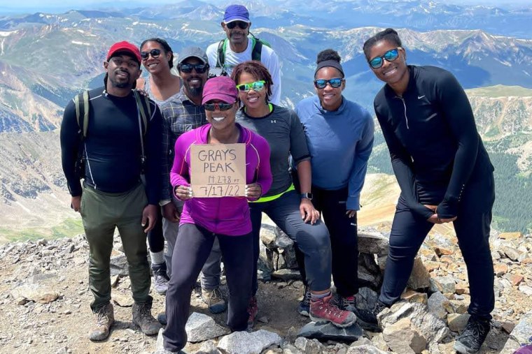 Members of Vibe Tribe Adventures gather at Grays Peak in Colorado, on July 17, 2022.