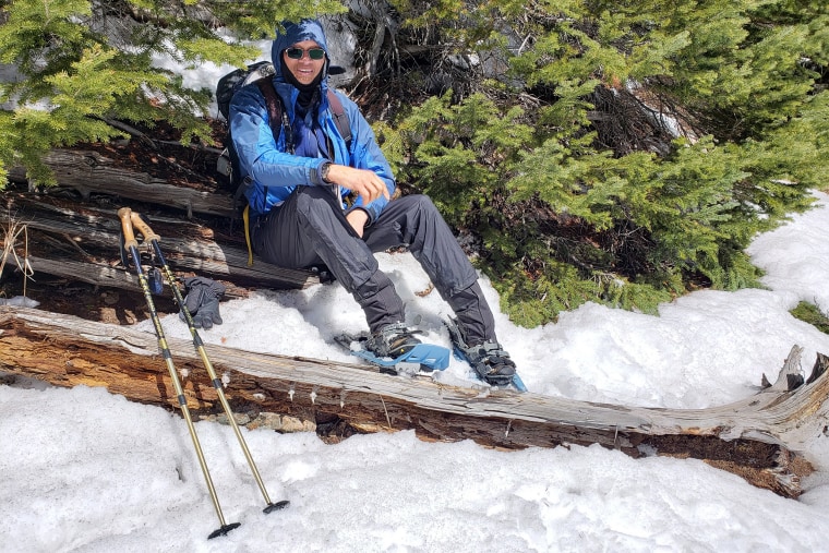 A member of Vibe Tribe Adventures rests from snowshoeing.