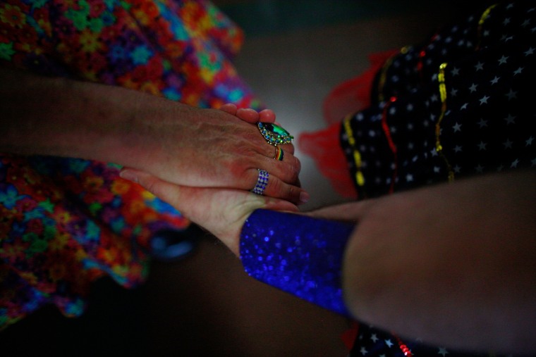 Russian River Sisters of Indulgence members holding hands at "Wonder Woman Bingo."