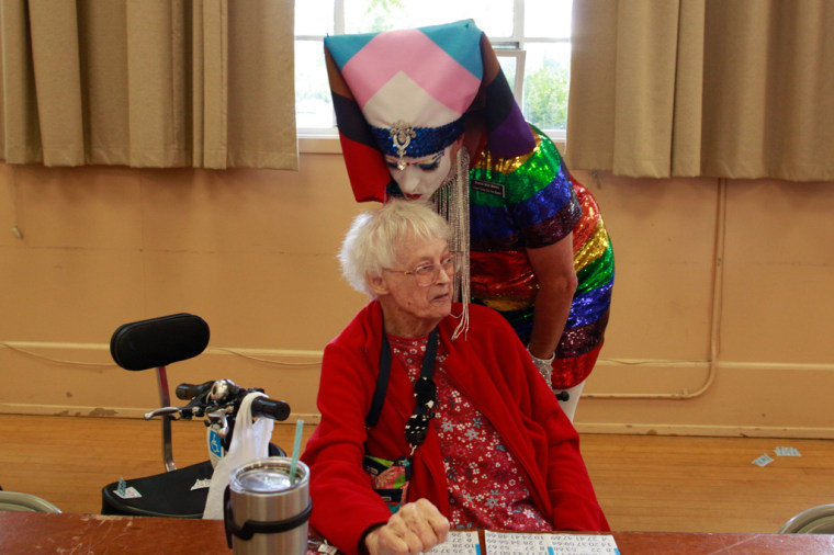 Russian River Sister of Perpetual Indulgence Sister Tooty Too Too Sweet kisses long-time bingo player Donna Nichols at "Wonder Woman Bingo" in Santa Rosa, Calif., on June 10.