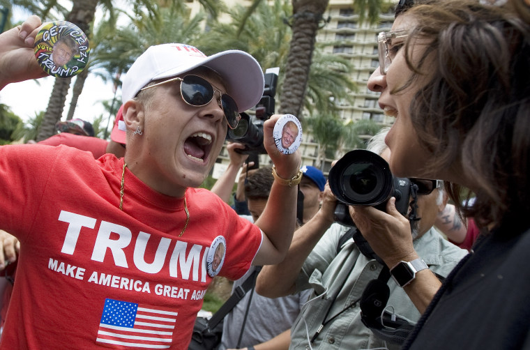 A Trump supporter argues with protester the Anaheim Convention Center in Anaheim, Calif.