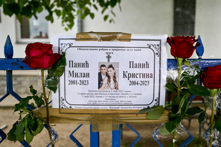 A memorial for a brother and a sister on May 6, 2023, who were killed at a school yard in a shooting in Dubona, Serbia.