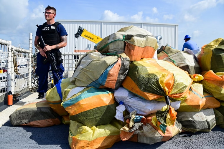 Petty Officer 3rd class Brandon New, a crew member of Coast Guard Cutter Bear, stands security watch during a drug offload at Miami, Florida, June 16, 2023.