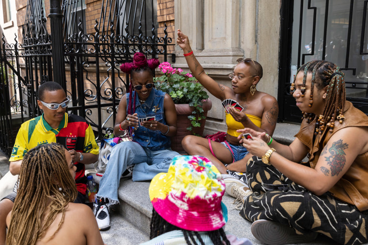 People play a game of Uno during a Queer Juneteenth Block Party in New York on Sunday, June 18, 2023.