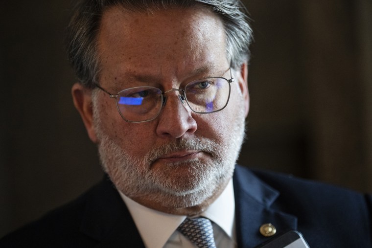 Sen. Gary Peters, D-Mich., talks with reporters at the Capitol on May 3, 2022.