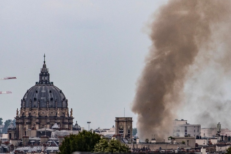 Image: Smoke rising from a building at Place Alphonse-Laveran in the 5th arrondissement of Paris, on June 21, 2023.