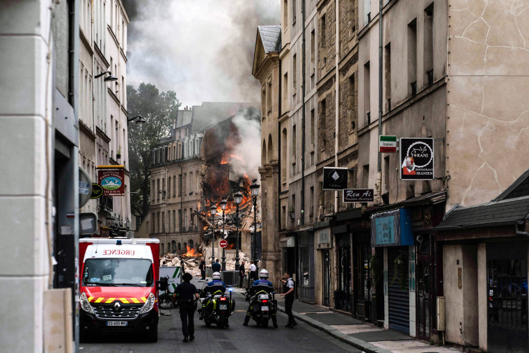 Image: Smoke billows from rubbles of a building at Place Alphonse-Laveran in the 5th arrondissement of Paris, on June 21, 2023. 