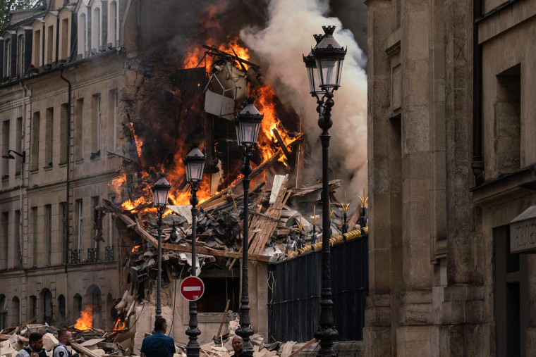 Image: Smoke billows from rubbles of a building at Place Alphonse-Laveran in the 5th arrondissement of Paris, on June 21, 2023.