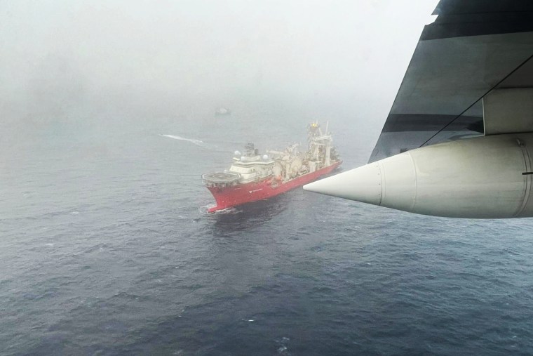 Images released by the U.S. Coast Guard show the Titan rescue efforts underway Tuesday.