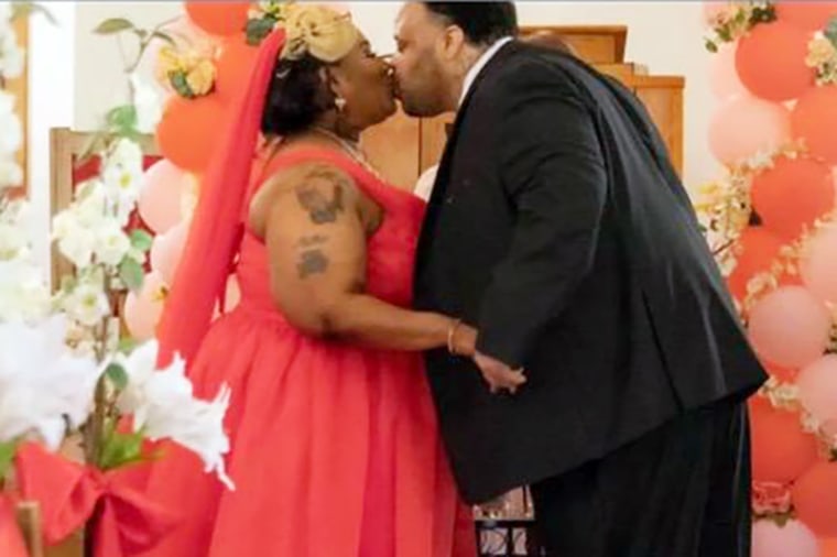 Toraze and Johnnie Mae Davis kiss at their wedding ceremony.