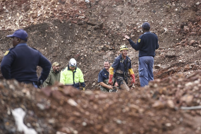 South African police investigate at the scene where more than 20 bodies, suspected of being illegal miners, were found near an active mine in Krugersdorp, South Africa, 
 on Nov. 3, 2022.