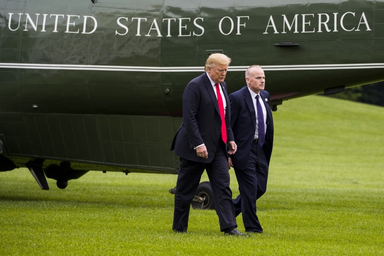 President Donald Trump walks with Secret Service special agent Robert Engel on the South Lawn of the White House on May 17, 2019.