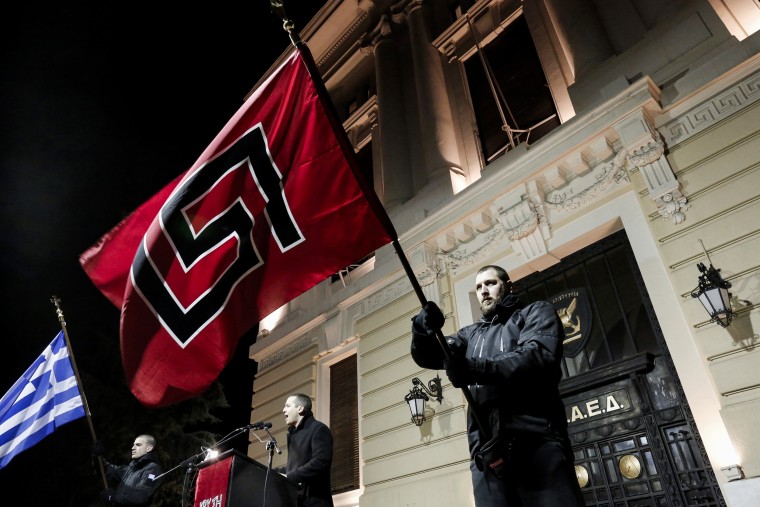 Ilias Kasidiaris, center, a lawmaker for the neo-Nazi Golden Dawn party, at a rally in Athens on Feb.1, 2014.