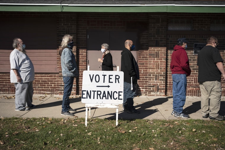 In this Nov. 3, 2020 file photo, voters wait in line outside a polling center on Election Day, in Kenosha, Wis. Wisconsin's top elections official is nearing the end of her term, and uncertainty looms over who will hold the position through the 2024 presidential election. Meagan Wolfe is the current, nonpartisan administrator of the Wisconsin Elections Commission. Republicans who control the state Legislature could have a chance to ouster her and pick someone new to oversee elections in the critical battleground state.