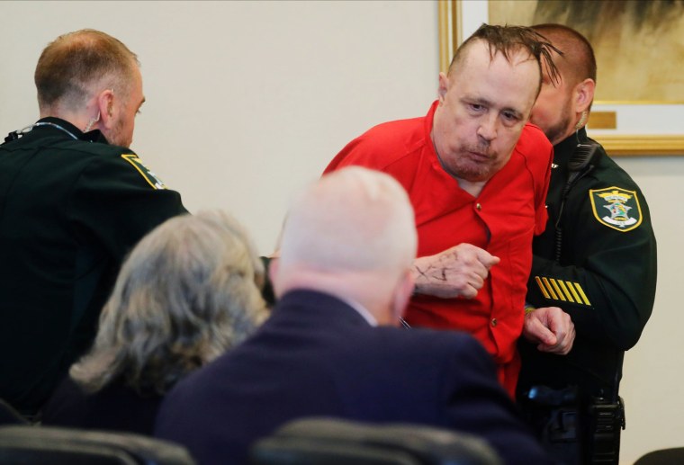 Convicted murderer Joseph Zieler is wrestled to the courtroom floor by Lee County Sheriff's deputies during a motion hearing on Monday, June 26, 2023. 