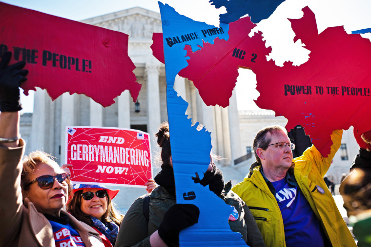 People protest during a fair maps rally at the Supreme Court in Washington, D.C.