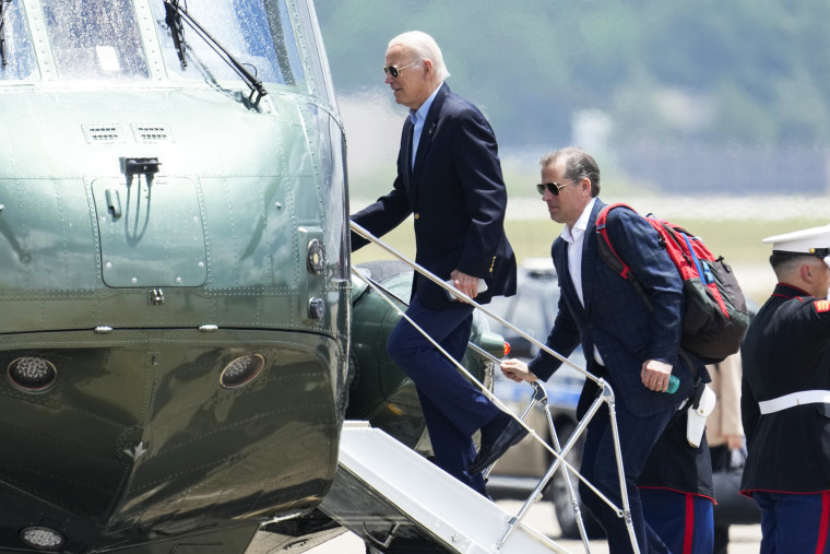 President Joe Biden boards Marine One with Hunter Biden